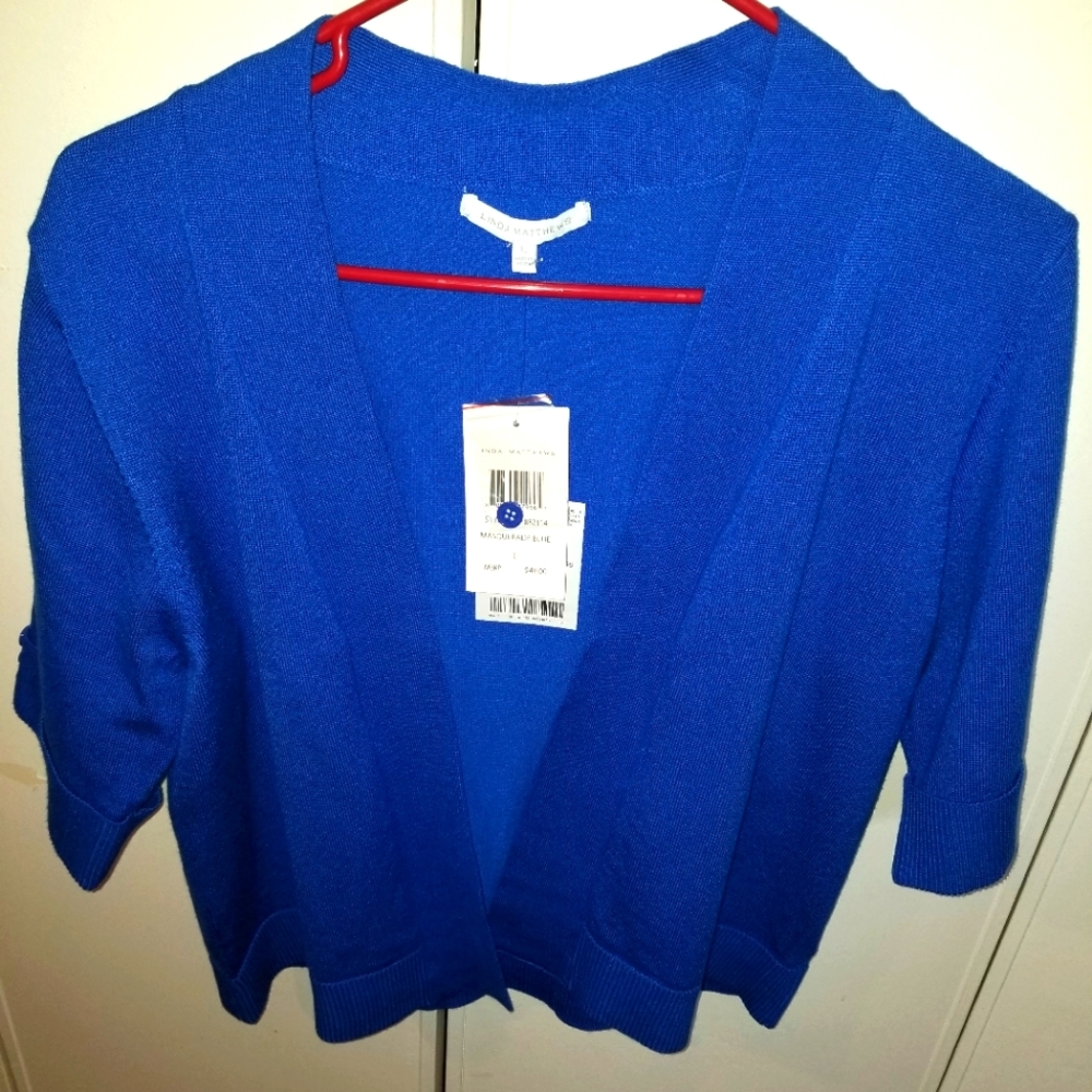 Blue shrug sweater by Linda Matthews.